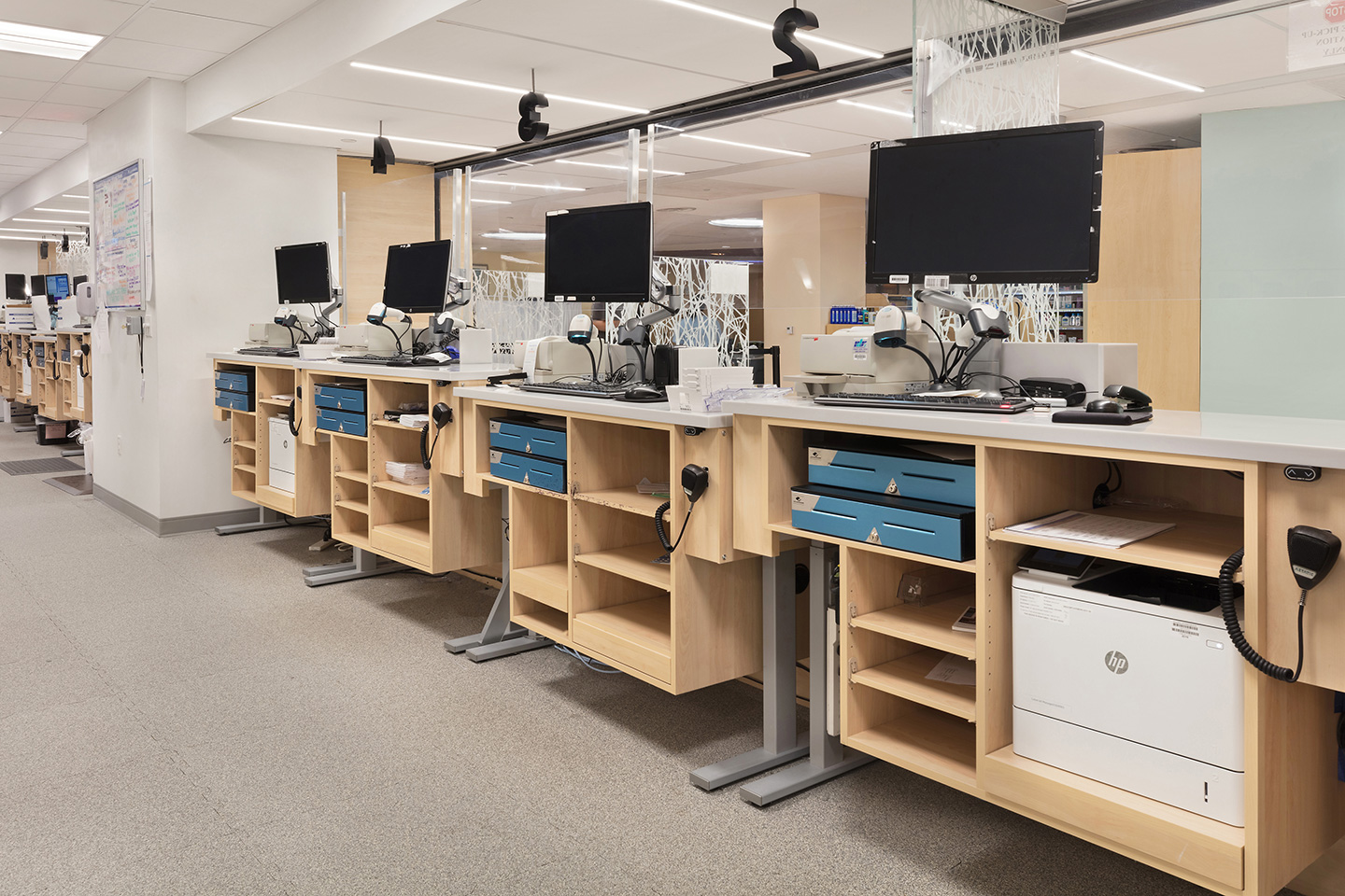 Streamlined workstations are adjustable and made with low-maintenance materials, increasing comfort and efficiency for pharmacists. 