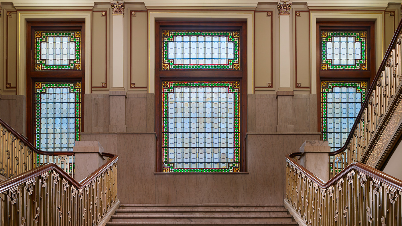 Design of the atrium allowed us to increase floor to ceiling heights, minimize covering of the existing façade, and bring in natural light to illuminate the existing stain glass windows.