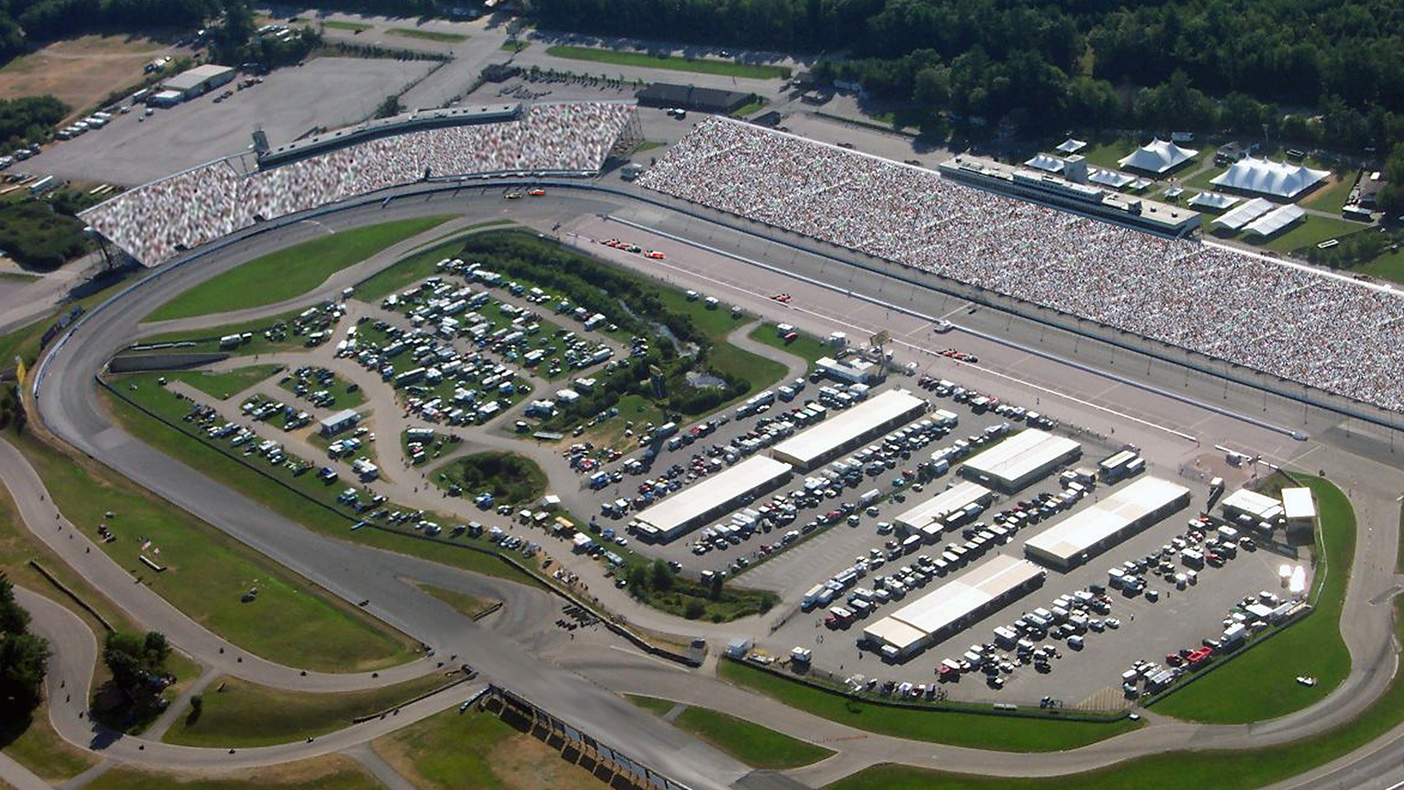For the NASCAR Loudon Speedway, NH, we designed a steel frame to support panel, whip and dish antennas with an equipment shelter at grade. Power, telco and ground hookups were designed for five Cell-on-Wheels sites during race events.