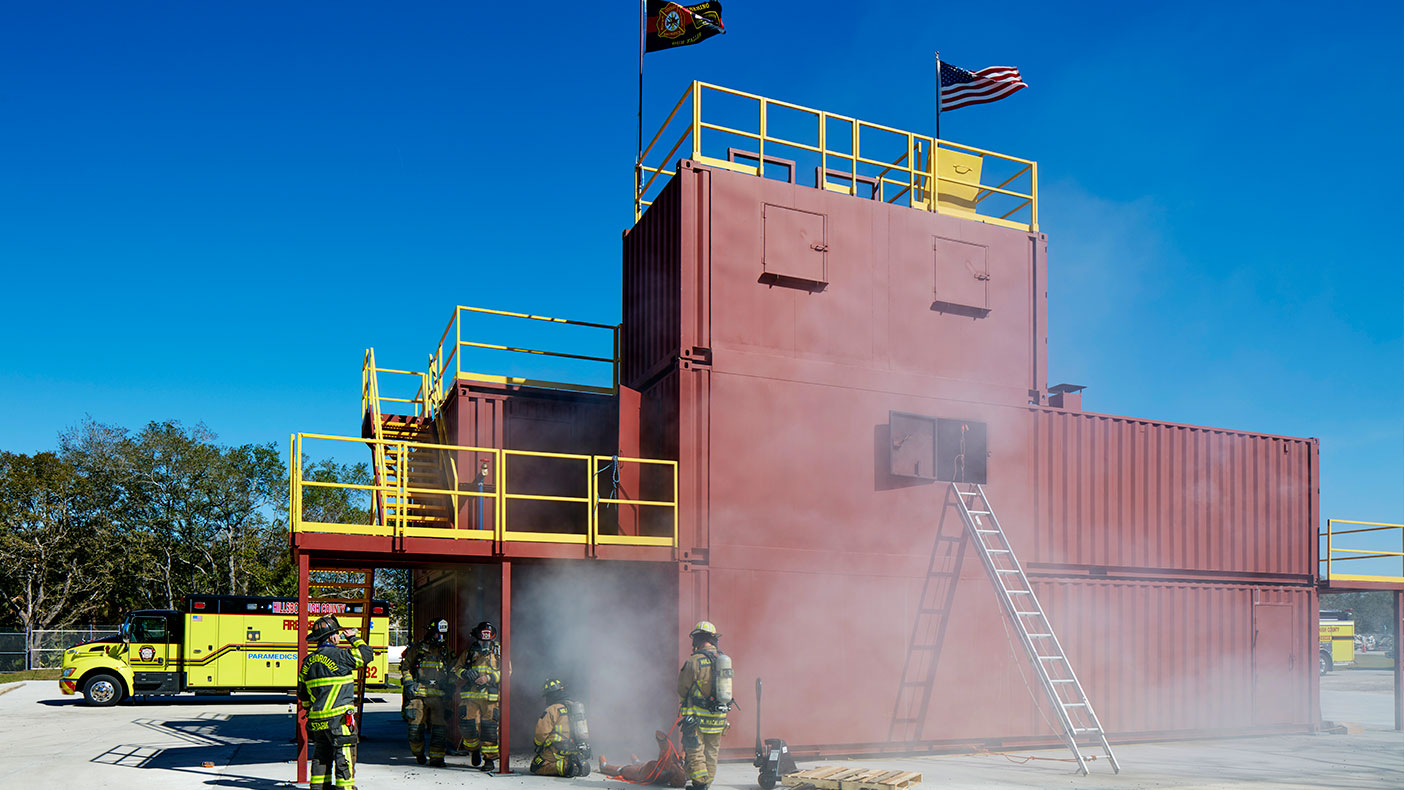 The exterior fire training area includes a burn building for live fire and rappel training.