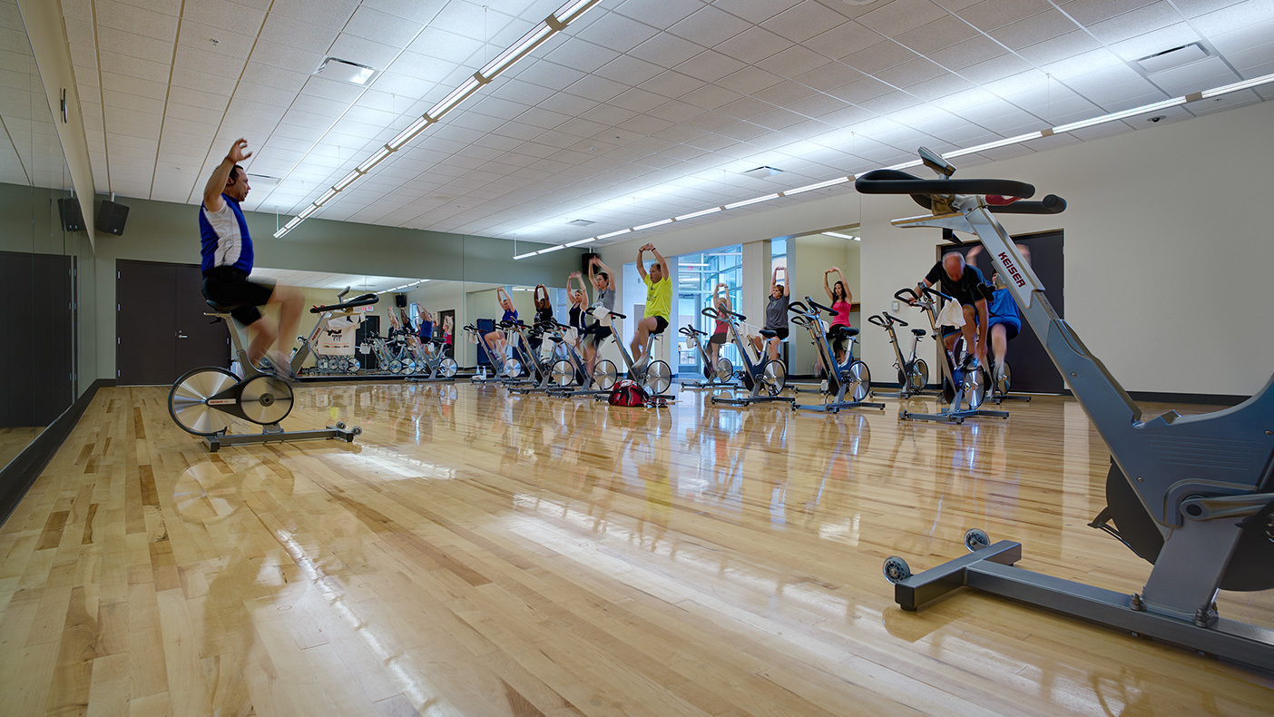 The main level features a 2,275-square-foot exercise studio with a floating wood floor system.