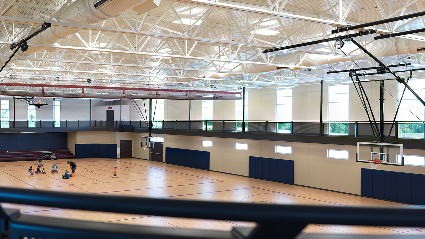 The lower level houses two basketball courts with a suspended perimeter, three-lane walking/jogging track; multi-purpose rooms; and a 5,000-square-foot branch library which will be converted to park district program space after five years.