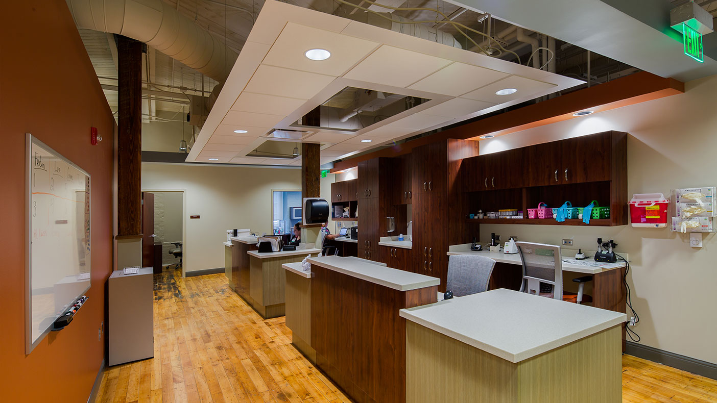 The interior spaces highlight the existing factory setting while providing contemporary, a state-of-the-art office environment for the myriad clinics, physical therapy, and rehabilitation treatment areas.