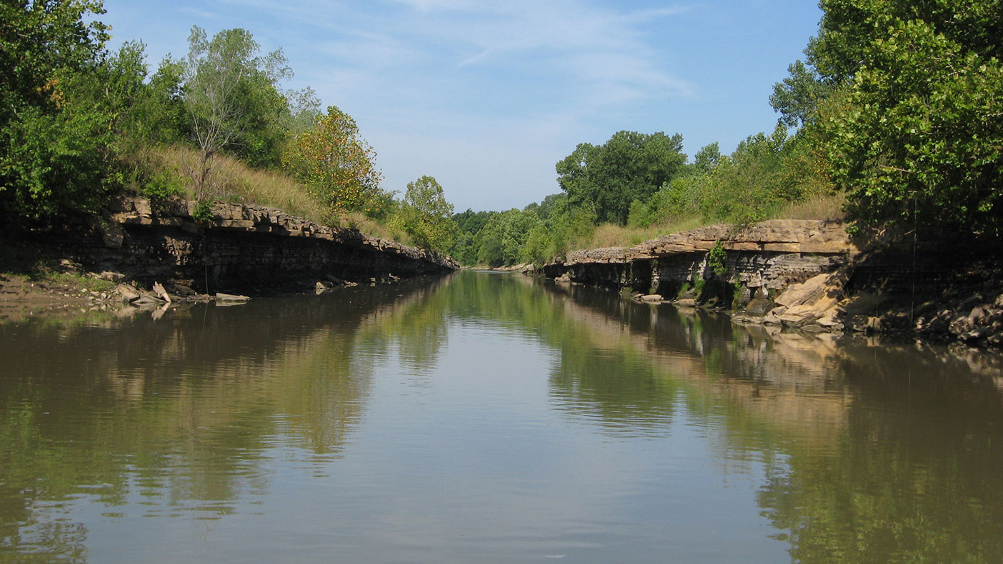 Mitigation involves the creation of a new watercourse channel and restoration of an existing channel, which will be bordered by herbaceous plants, shrubs, and forest areas, and which will connect to and enhance existing, historic wetland areas.