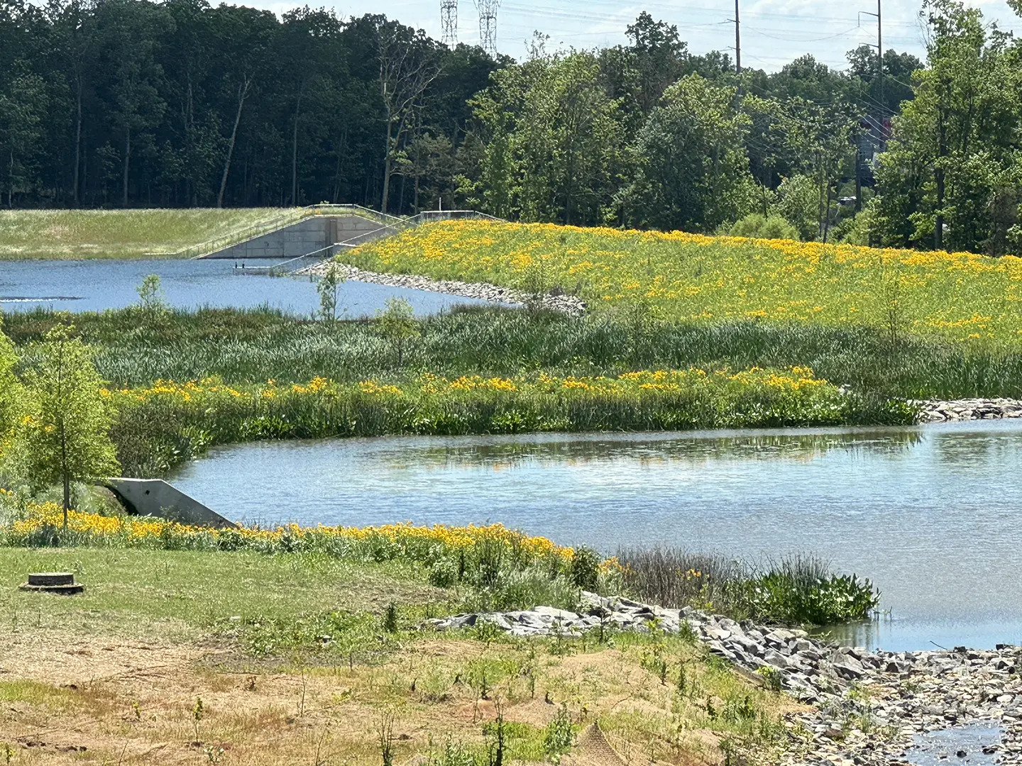 The Atlantic Research Corporation’s 35-acre lake also includes a series of upstream wetland and marsh areas with over 2,500 linear feet of stream restoration and 3,700 linear feet of access roads.