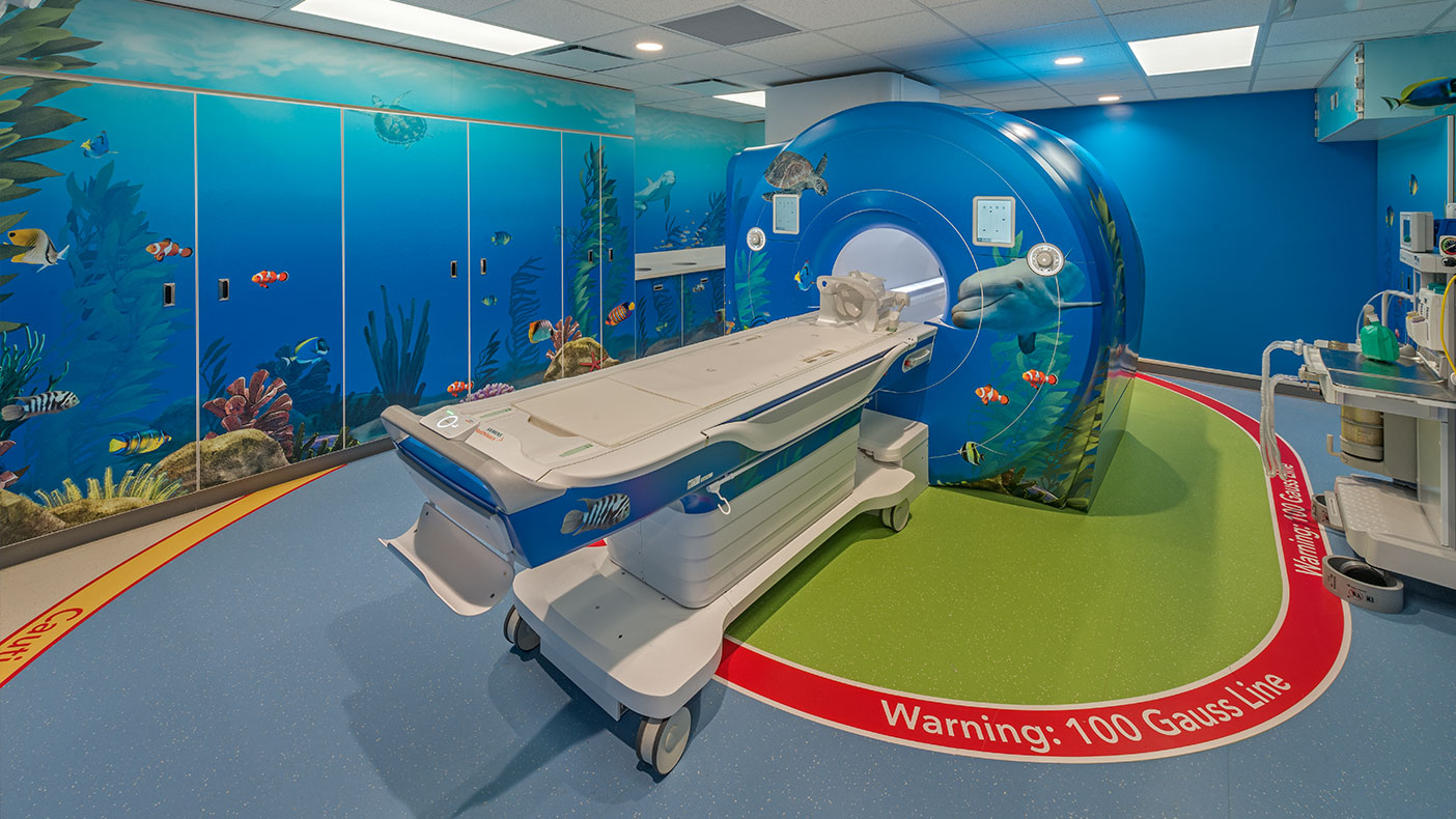 The walls, millwork, and MRI were all wrapped in the “underwater bliss” theme.