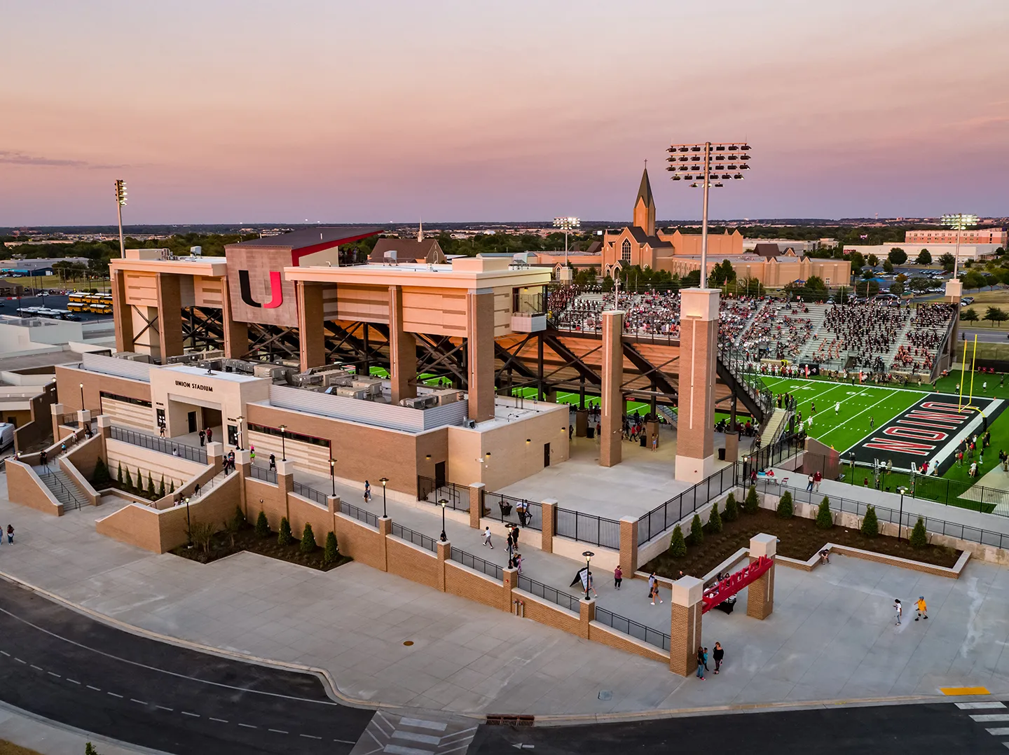 The exterior design of the stadium draws heavily from the existing materials on campus—most notably the mushroom-colored brick with lighter colored brick to complement.